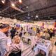 Visitors exploring vendors and crystals at the Crystal Dreams Wellness and Spirituality Event
