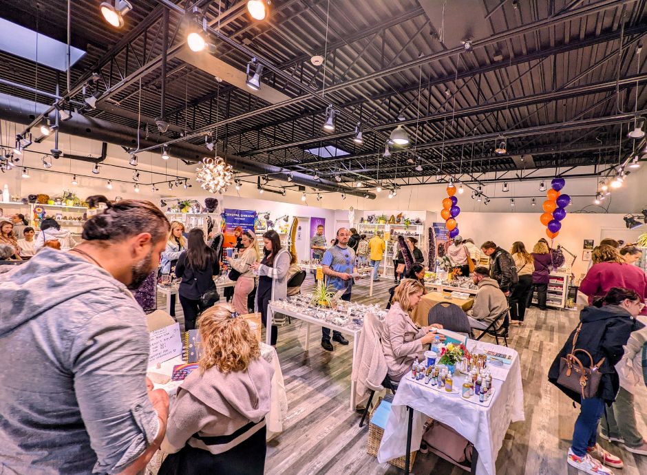 Visitors exploring vendors and crystals at the Crystal Dreams Wellness and Spirituality Event